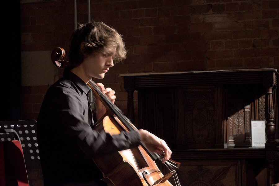 Malcolm Goodare playing the cello passionately.